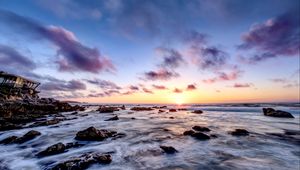 Preview wallpaper sea, stones, horizon, sunset, clouds, nature