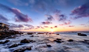 Preview wallpaper sea, stones, horizon, sunset, clouds, nature