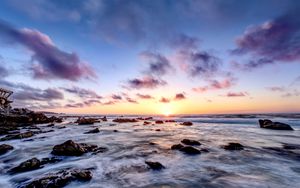 Preview wallpaper sea, stones, horizon, sunset, clouds, nature