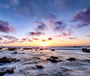 Preview wallpaper sea, stones, horizon, sunset, clouds, nature