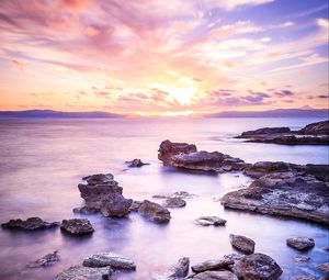 Preview wallpaper sea, stones, horizon, sky, clouds, nature