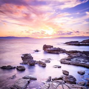 Preview wallpaper sea, stones, horizon, sky, clouds, nature