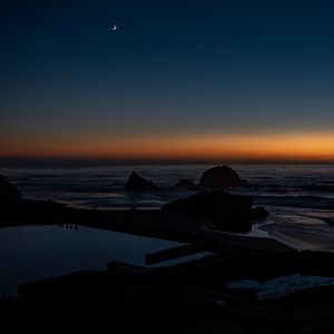 Preview wallpaper sea, stones, moon, twilight, dark