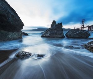 Preview wallpaper sea, stones, morning, fog, bridge, movement, stream