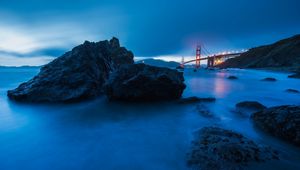 Preview wallpaper sea, stones, night, fog, bridge, fires