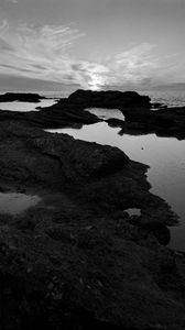 Preview wallpaper sea, stones, reefs, dark, black and white, nature