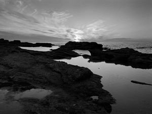 Preview wallpaper sea, stones, reefs, dark, black and white, nature