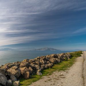 Preview wallpaper sea, stones, road, nature