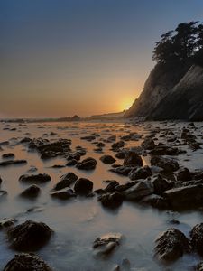 Preview wallpaper sea, stones, rocks, landscape, sunset