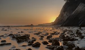 Preview wallpaper sea, stones, rocks, landscape, sunset