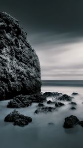 Preview wallpaper sea, stones, rocks, fog, horizon, clouds