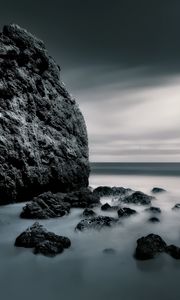 Preview wallpaper sea, stones, rocks, fog, horizon, clouds