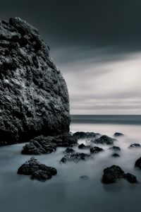 Preview wallpaper sea, stones, rocks, fog, horizon, clouds