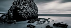 Preview wallpaper sea, stones, rocks, fog, horizon, clouds