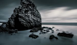 Preview wallpaper sea, stones, rocks, fog, horizon, clouds