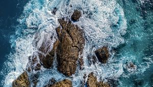 Preview wallpaper sea, stones, sea foam, aerial view, nature