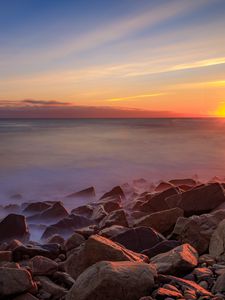 Preview wallpaper sea, stones, stone, coast, horizon, sunset