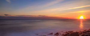Preview wallpaper sea, stones, stone, coast, horizon, sunset