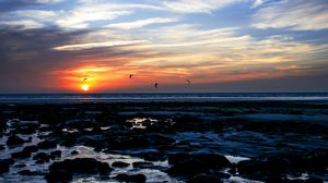 Preview wallpaper sea, stones, sunset, birds