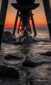 Preview wallpaper sea, stones, sunset, construction