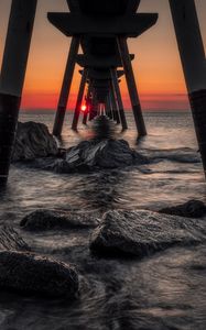 Preview wallpaper sea, stones, sunset, construction