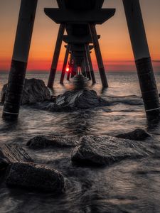 Preview wallpaper sea, stones, sunset, construction