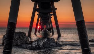 Preview wallpaper sea, stones, sunset, construction