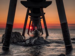Preview wallpaper sea, stones, sunset, construction