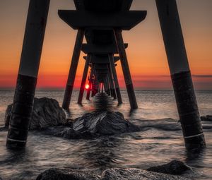 Preview wallpaper sea, stones, sunset, construction