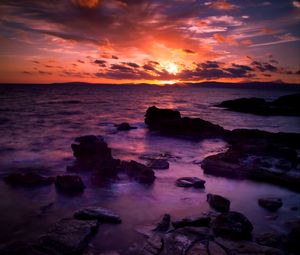 Preview wallpaper sea, stones, sunset, clouds