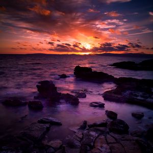 Preview wallpaper sea, stones, sunset, clouds