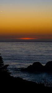 Preview wallpaper sea, stones, sunset, horizon, dark
