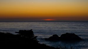 Preview wallpaper sea, stones, sunset, horizon, dark