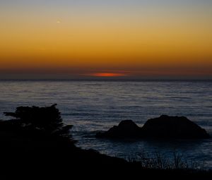 Preview wallpaper sea, stones, sunset, horizon, dark