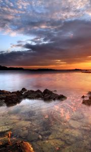 Preview wallpaper sea, stones, water, transparent, decline, evening, sky, beacon