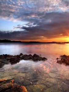 Preview wallpaper sea, stones, water, transparent, decline, evening, sky, beacon