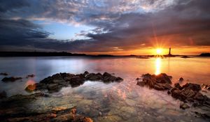 Preview wallpaper sea, stones, water, transparent, decline, evening, sky, beacon