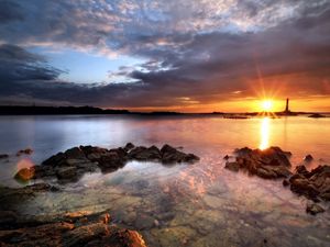 Preview wallpaper sea, stones, water, transparent, decline, evening, sky, beacon