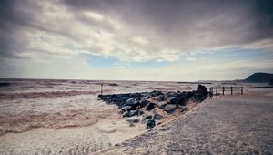 Preview wallpaper sea, storm, pier, water, stones, colors