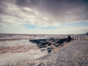 Preview wallpaper sea, storm, pier, water, stones, colors