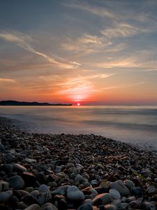 Preview wallpaper sea, sunrise, pebbles, shore, horizon