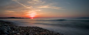 Preview wallpaper sea, sunrise, pebbles, shore, horizon