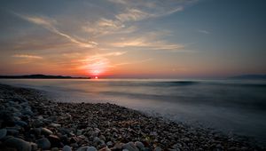 Preview wallpaper sea, sunrise, pebbles, shore, horizon