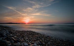 Preview wallpaper sea, sunrise, pebbles, shore, horizon