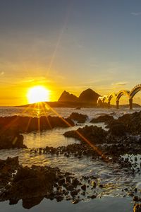 Preview wallpaper sea, sunrise, rocks, bridge, nature