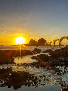 Preview wallpaper sea, sunrise, rocks, bridge, nature