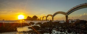 Preview wallpaper sea, sunrise, rocks, bridge, nature