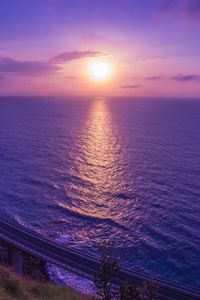 Preview wallpaper sea, sunset, bridge, horizon, purple, lilac