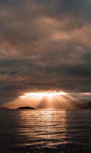 Preview wallpaper sea, sunset, clouds, sunbeams, light