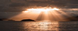 Preview wallpaper sea, sunset, clouds, sunbeams, light